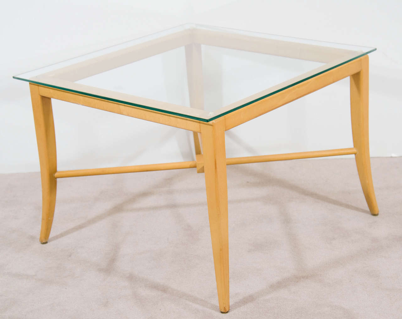 A vintage pair of side and end tables by Tommi Parzinger, produced circa 1950s, with glass top (1/8