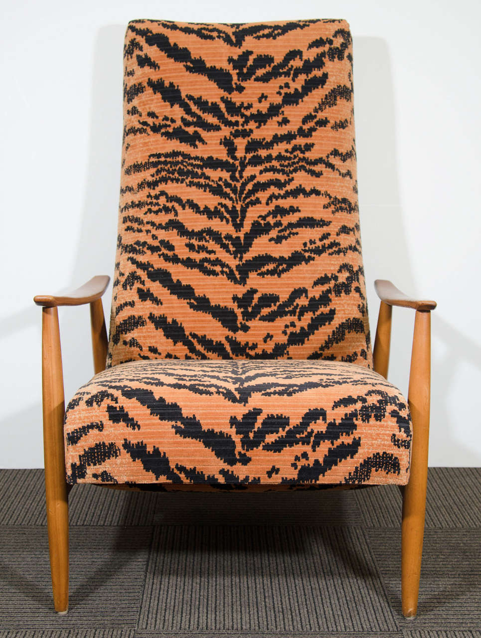 A vintage reclining lounge chair in teak with tiger velvet upholstery by Milo Baughman.