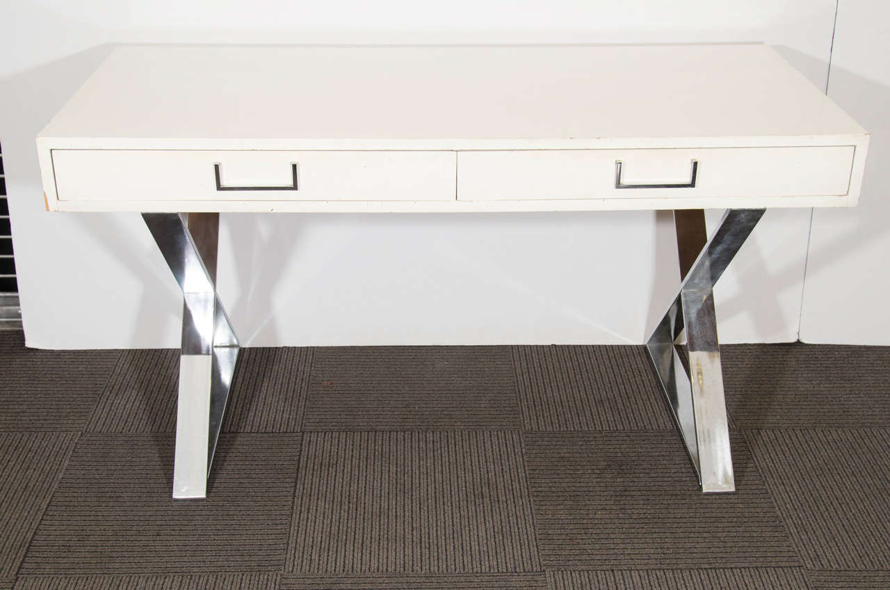 A vintage sleek white lacquer two-drawer Milo Baughman Campaign desk or console with Chromed Flat Band X-base.Substantial and Well Constructed ,Great for an  High End Office Interior.

