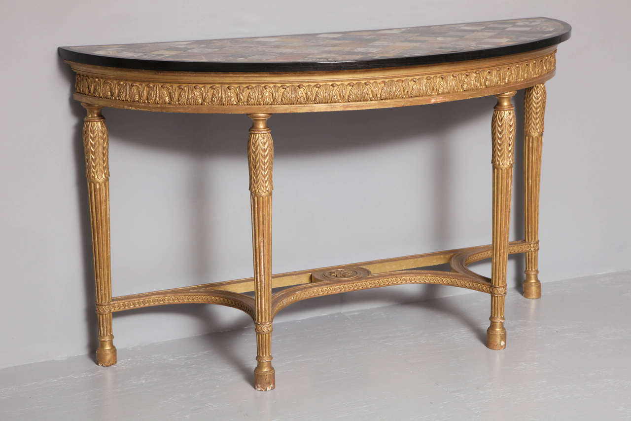 Very fine George III Adam period giltwood demilune console table, circa 1780, the later Grand Tour specimen marble top with over 130 examples of various marbles and other hardstone including, Egyptian Porphyry, Blue John, Sicilian Jasper with a