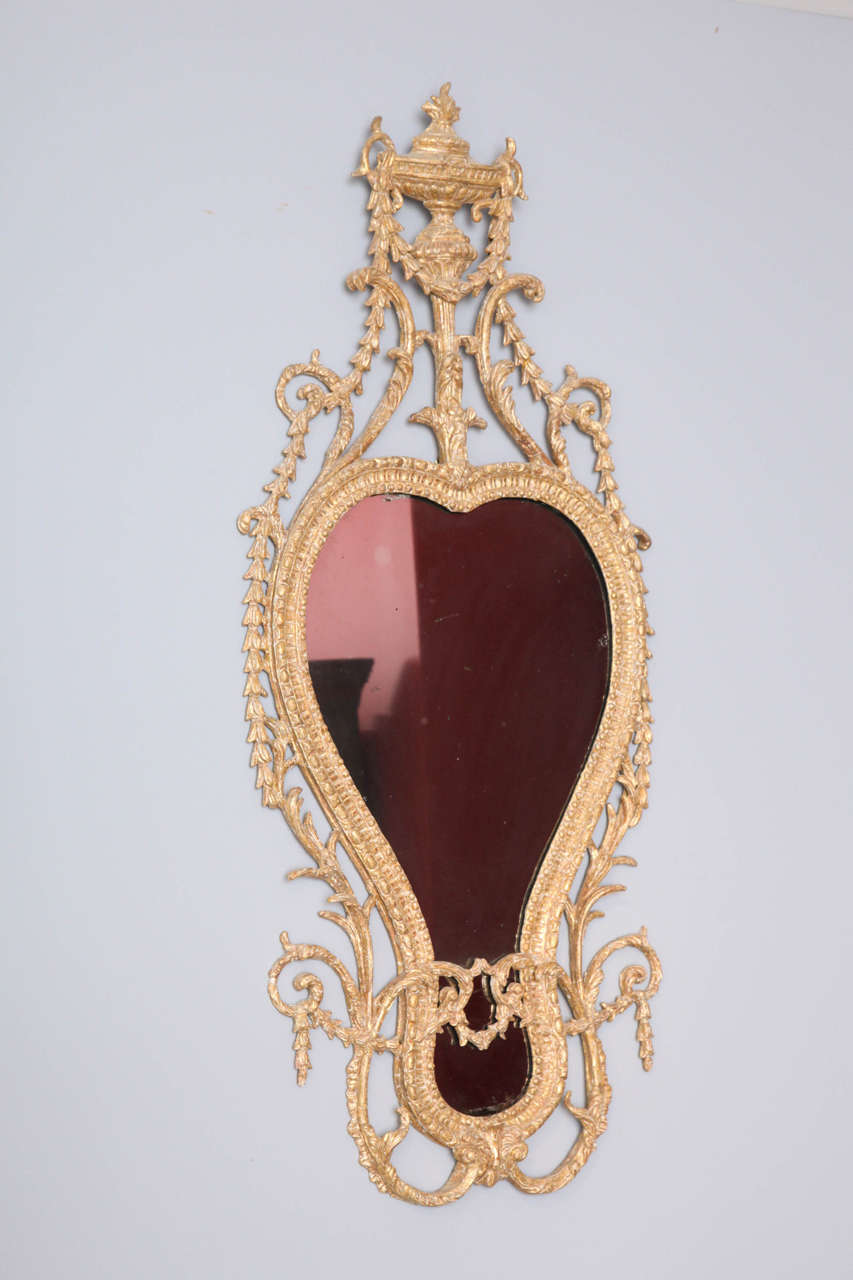 A very fine carved wood and ‘carton pierre’ mirror retaining its original gilding and original mirror plate. This mirror has been dry stripped and retains all its original clay color and much of its original gilding.
John Linnell was among the