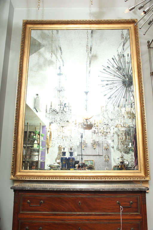 A Swedish Large Scale Looking Glass with Giltwood Frame