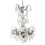 A 6 Light French Louis XVI Style Patinated Bronze Chandelier