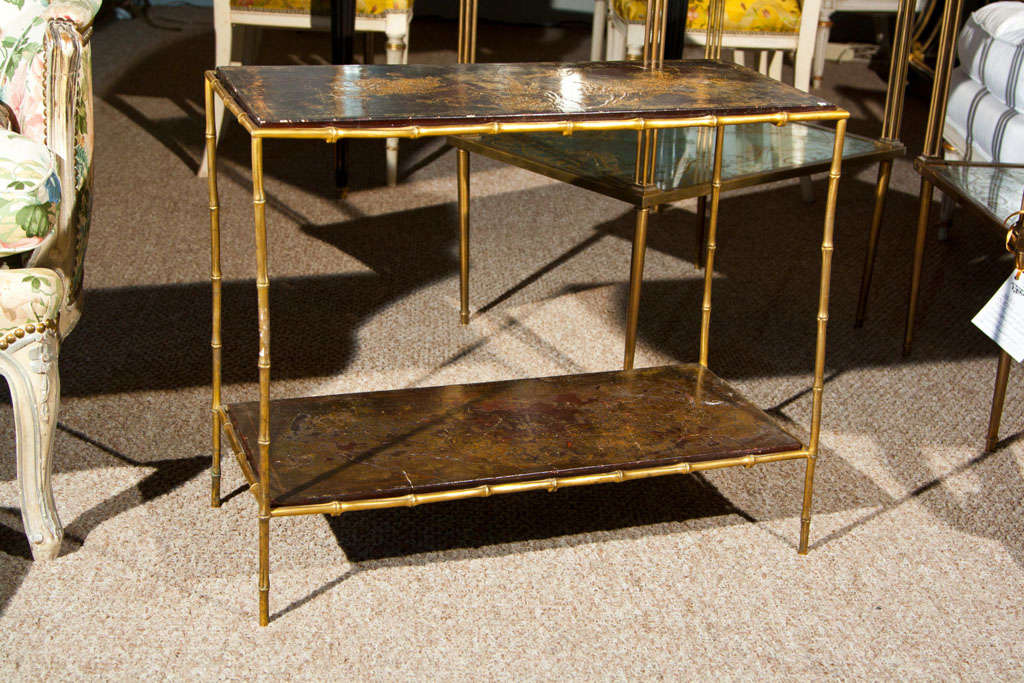 Maison Jansen Two Tier Bronze faux bamboo Side table with Chinoiserie decorated inserts. This piece is accompanied by a letter of authentication and quality by James Archer Abbott author JANSEN FURNITURE book.