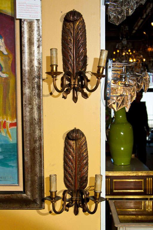 Pair of Jansen carved wood with brass sconces in feather form with ribbons. Two Lights.