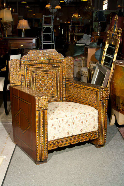 Pair of Inlaid Antique Syrian Club chairs with tailored backs and squared arms.  Stunning craftsmanship, upholstered seats.
