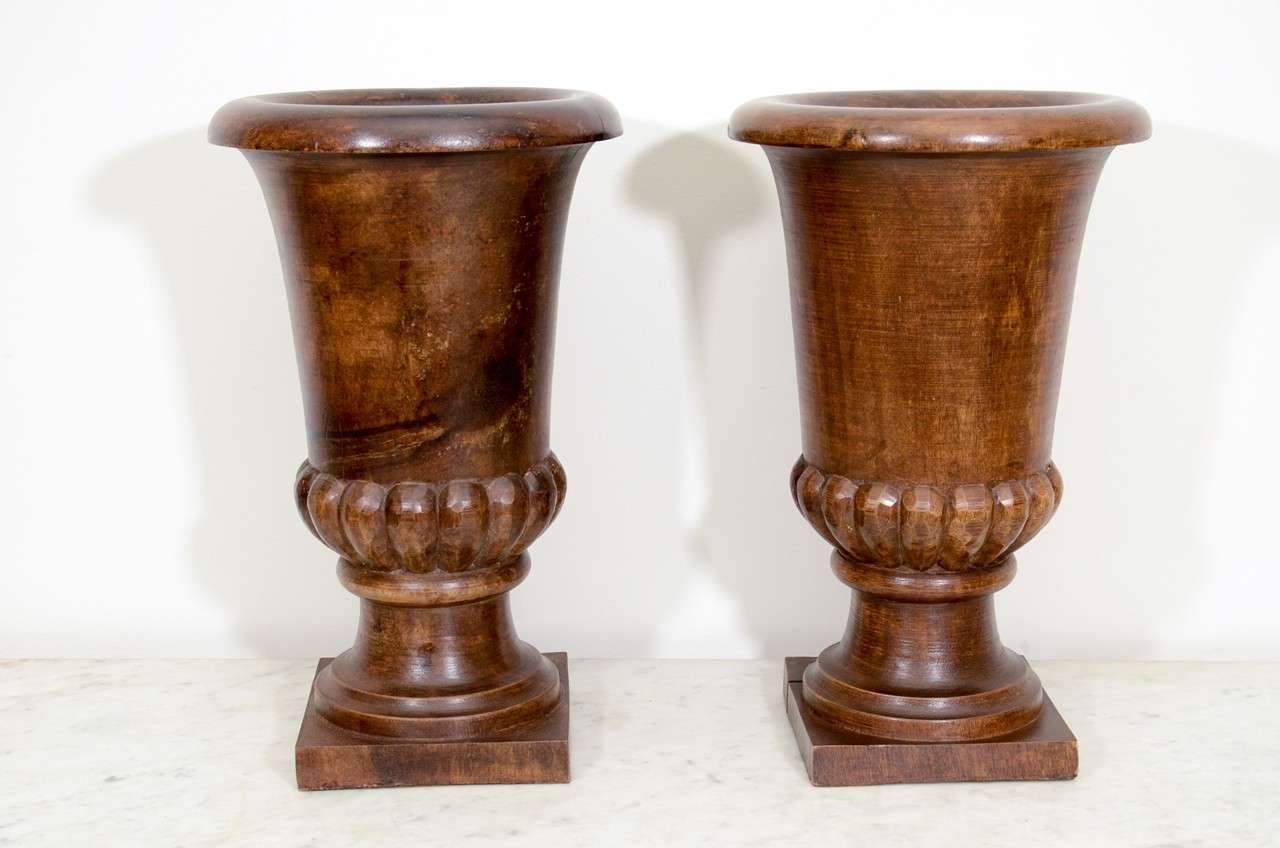 Pair of wooden urns