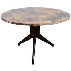 An Aldo Tura Lacquered Parchment Round Table. 