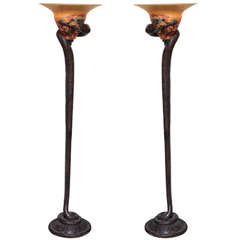 Pair of Art Deco style bronze and art glass snake form floor lamps.