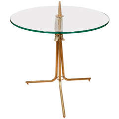 Round glass side table with decorative brass tripod base
