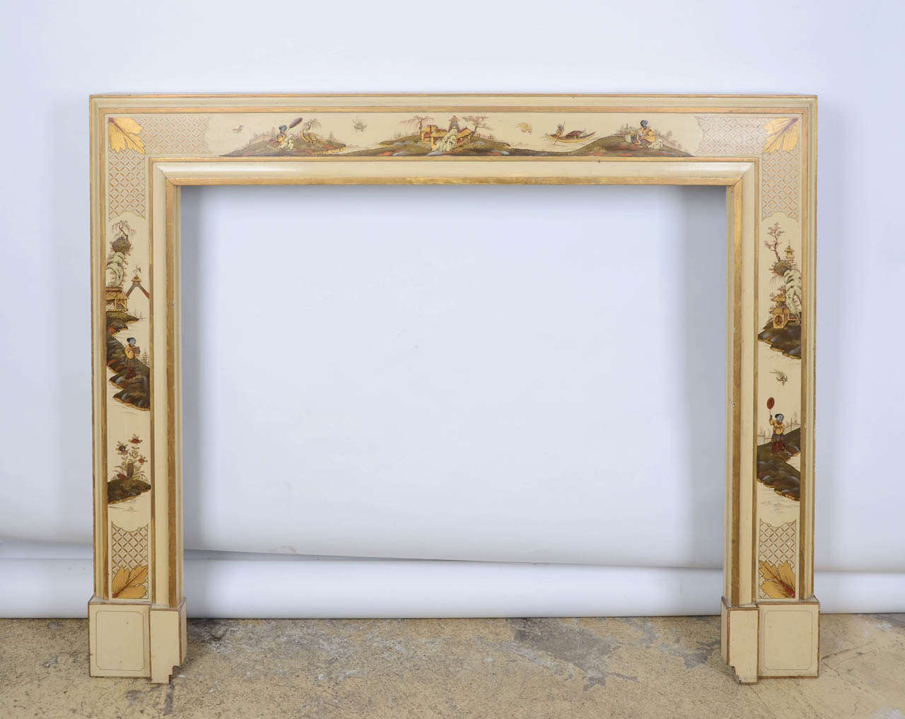 A very special fire surround dating from the 1930s. This lacquered wooden fire surround has exquisite 'Chinoiserie' illustrations painted in muted tones and accented with gold, with Oriental-inspired decoration depicting a pastoral and waterside