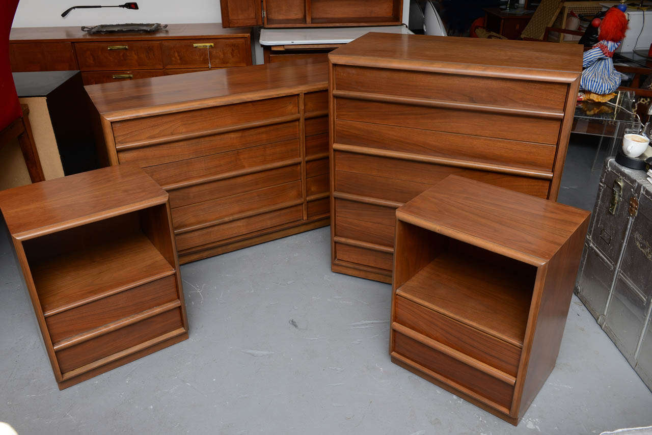 Beautifully restored 4 piece bedroom set by Robsjohn-Gibbings for Widdicomb from the 1950s.  Priced as a set, but can be sold separately, please inquire for prices.  Measuresments are as follows:
Nightstands:  15D 25H 19W
Highboy:  21D 40H