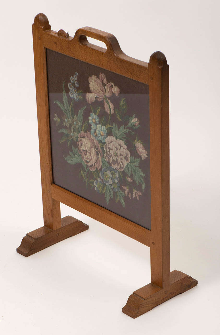 A Robert “Mouseman" Thompson Oak Firescreen of rectangular form.
Carved mouse to top.
Embroidered panel inset.
English
Circa 1960
67cms h x 48cms w x 23cms d