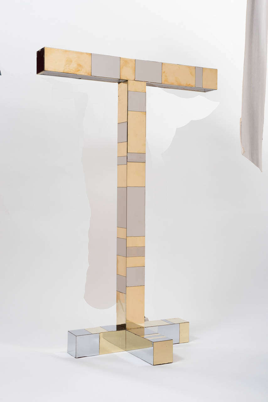 A Floor light designed by Paul Evans and made for Directional.
Cityscape series.
Decorated with geometric patchwork in chrome and brass.
USA
Circa 1970
137 cms high x 92cms wide x 35cms d

Paul Evans was born in Pennsylvania in 1931. He studied