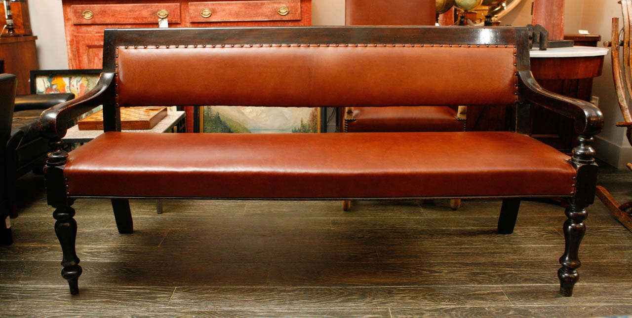 19th century English ebonized and upholstered leather bench from Masonic Lodge. 