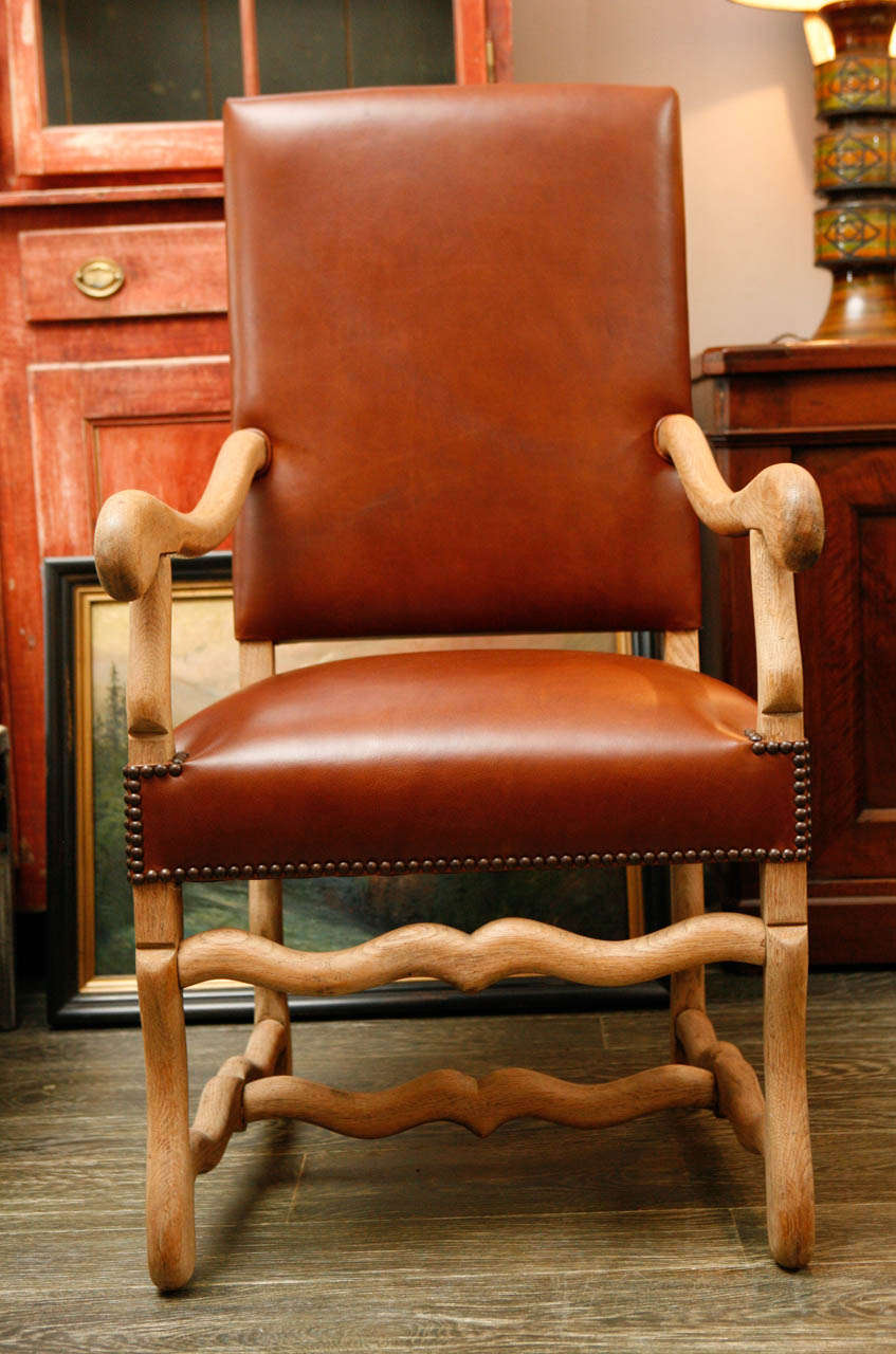 19th century pair of chairs in bleach oak and elm, upholstered in leather.