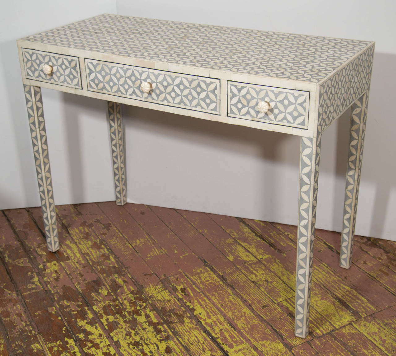 3 drawer hand inlaid grey and white desk with a classic geometric pattern. Camel bone inset in resin laminated on wood.