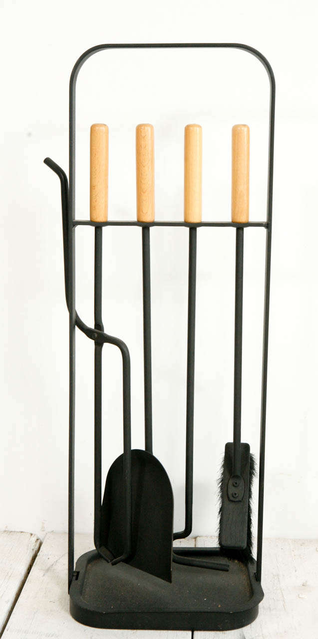 Handsome modern four piece fireplace tool set.