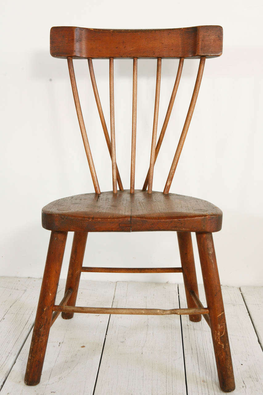Rustic accent chair with distinct spindle back.