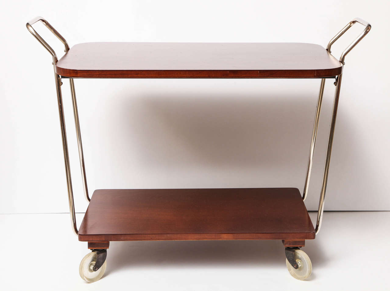 Bar cart, C 1950. Wood with chrome details. The wood has been refinished and the chrome has been polished.