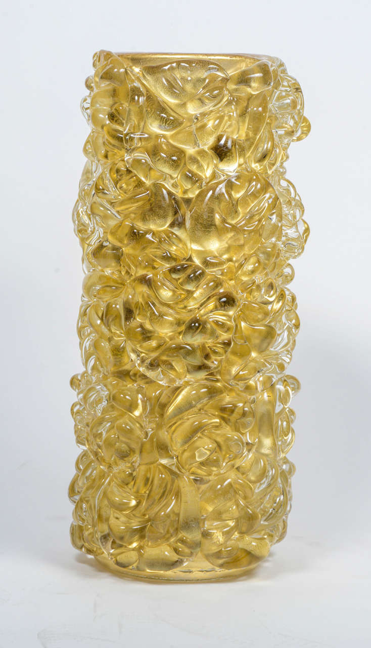 Amazing set of four different vases made of Murano glass by the master Fabiano Amadi. Each vase weight more than 30kg and made by hand by the artist in Murano where he introduce gold leaves inside the glass to provide it this shinny and golden