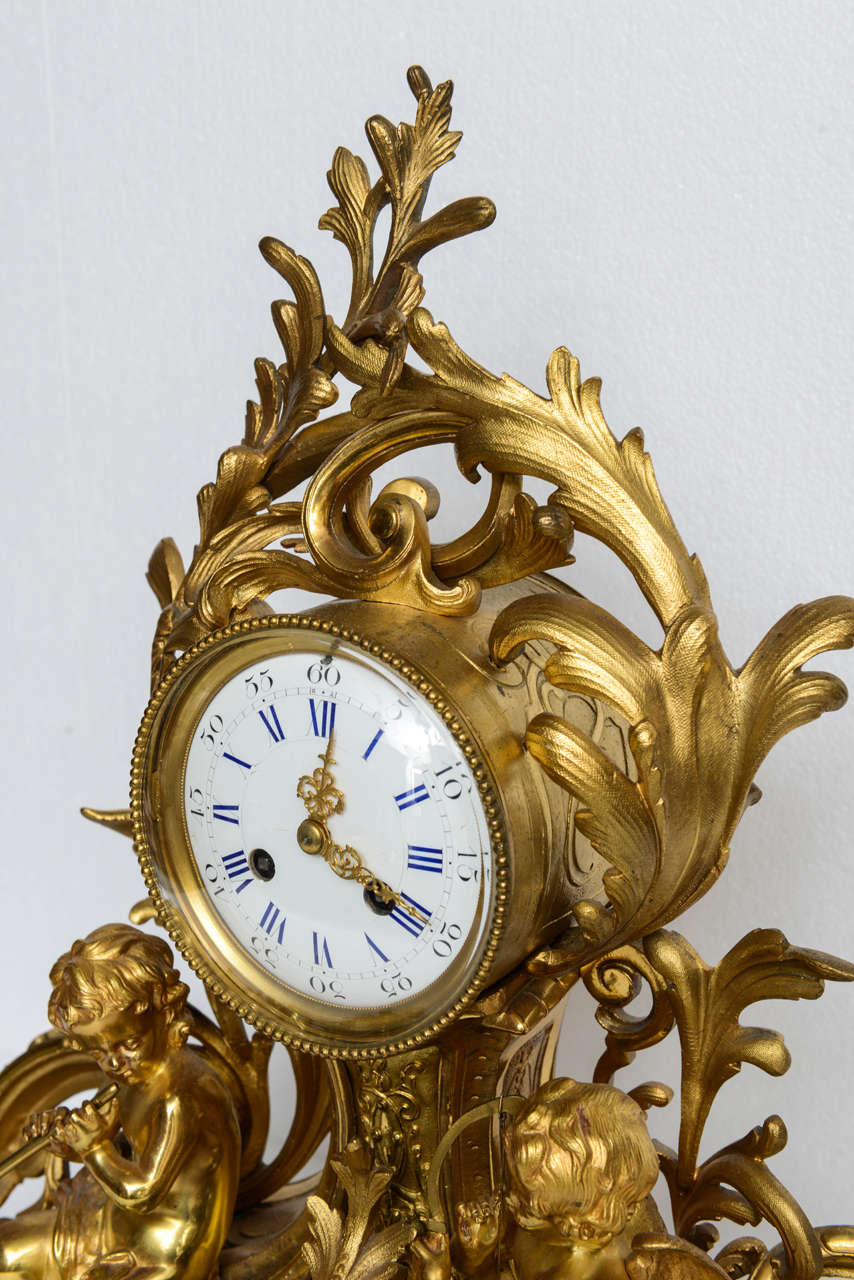 Pair of French Louis XV Mantel Clocks with Putti, 19th Century In Good Condition For Sale In West Palm Beach, FL