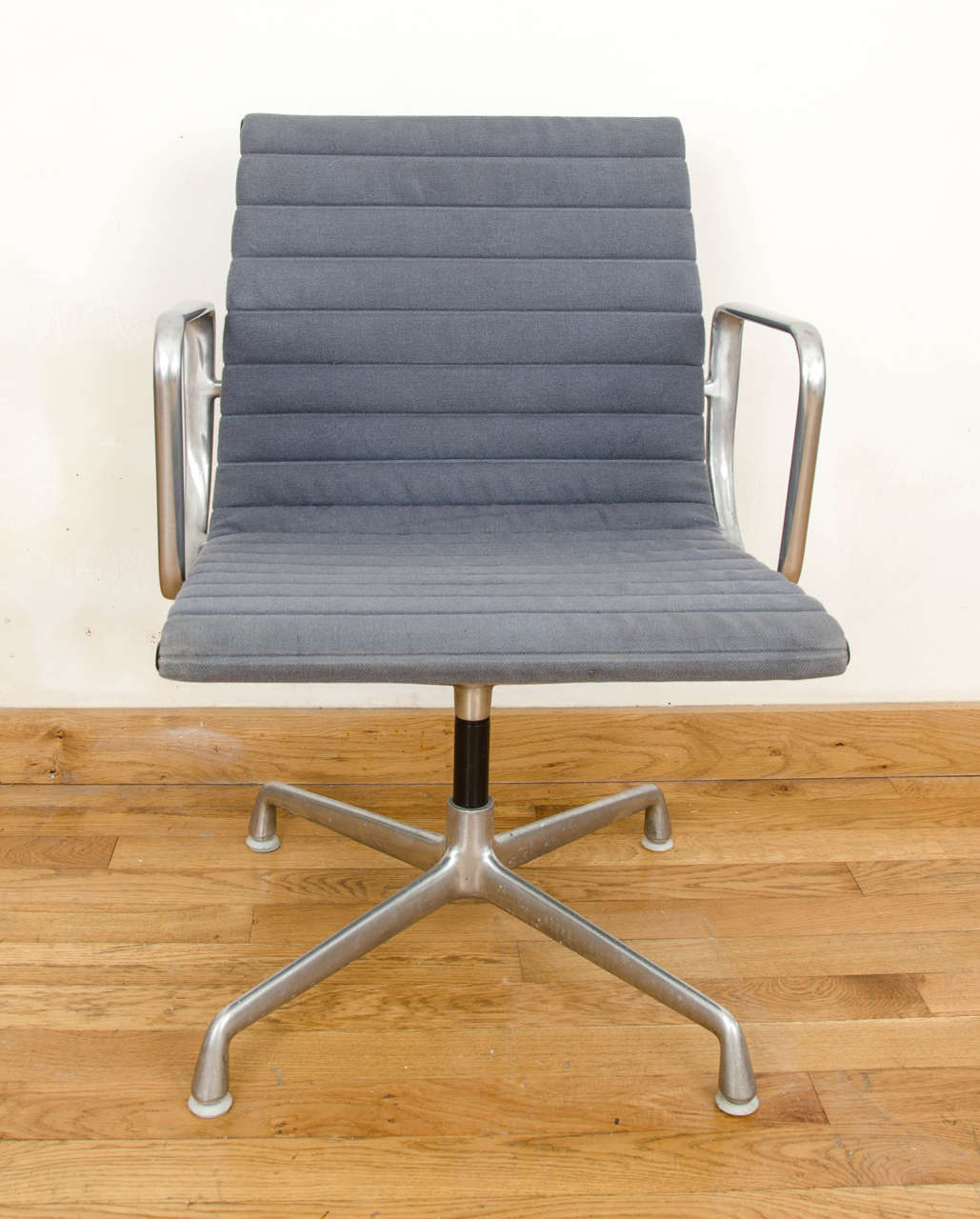 Set of eight  Eames aluminium group management chairs
Marked Herman Miller 938-138
Pale grey fabric upholstery
excellent condition
small hole in the fabric on one seat