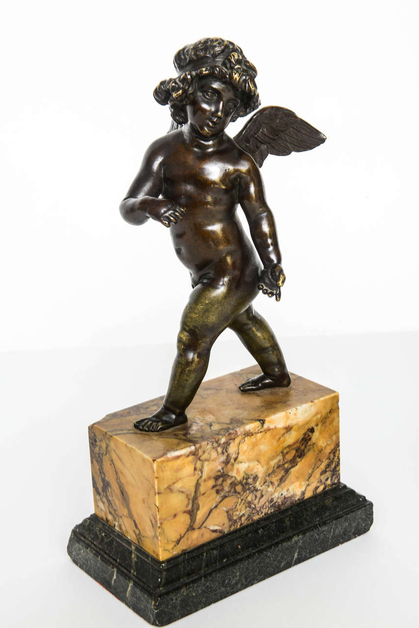 Patinated Pair of French Bronze Striding Cupids, circa 1800