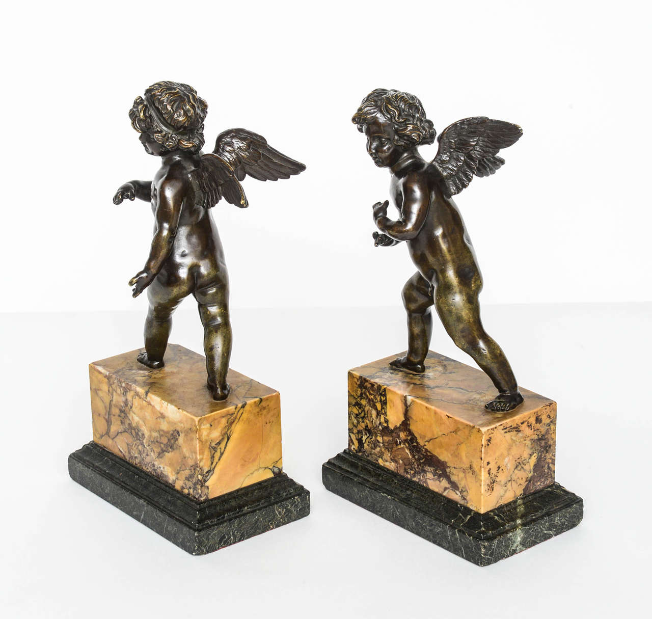 Pair of French Bronze Striding Cupids, circa 1800 In Excellent Condition In Kensington, MD
