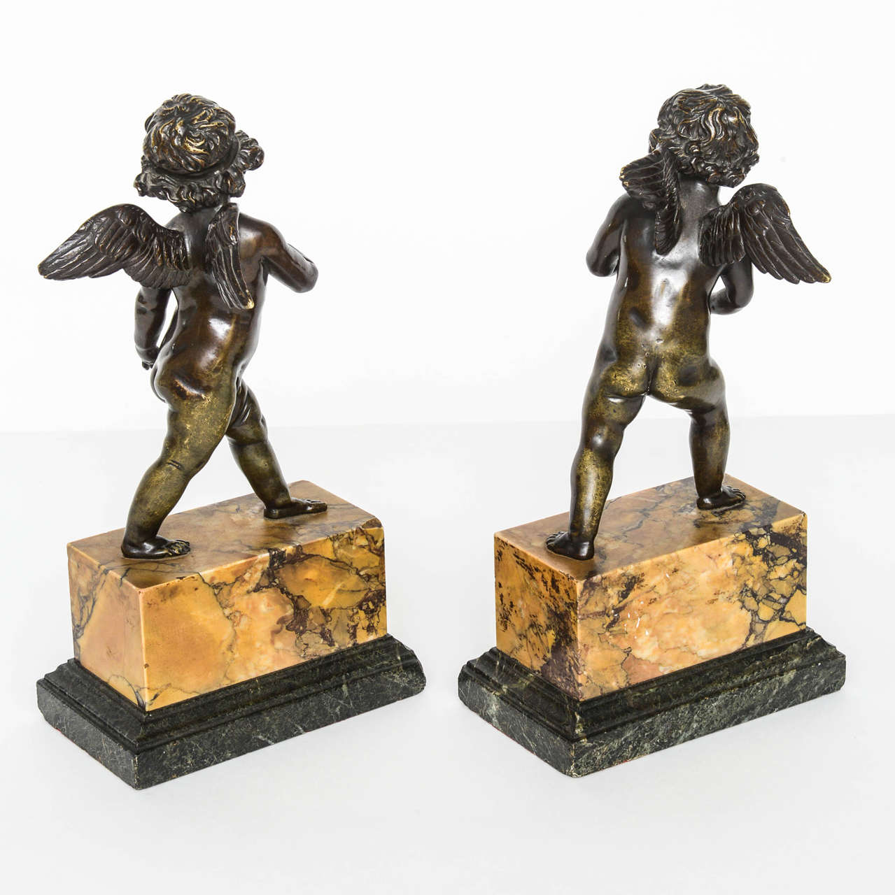 18th Century Pair of French Bronze Striding Cupids, circa 1800