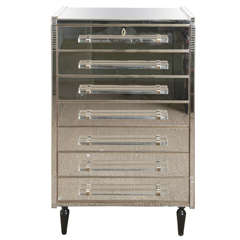 Commode with seven drawers all in mirror.
