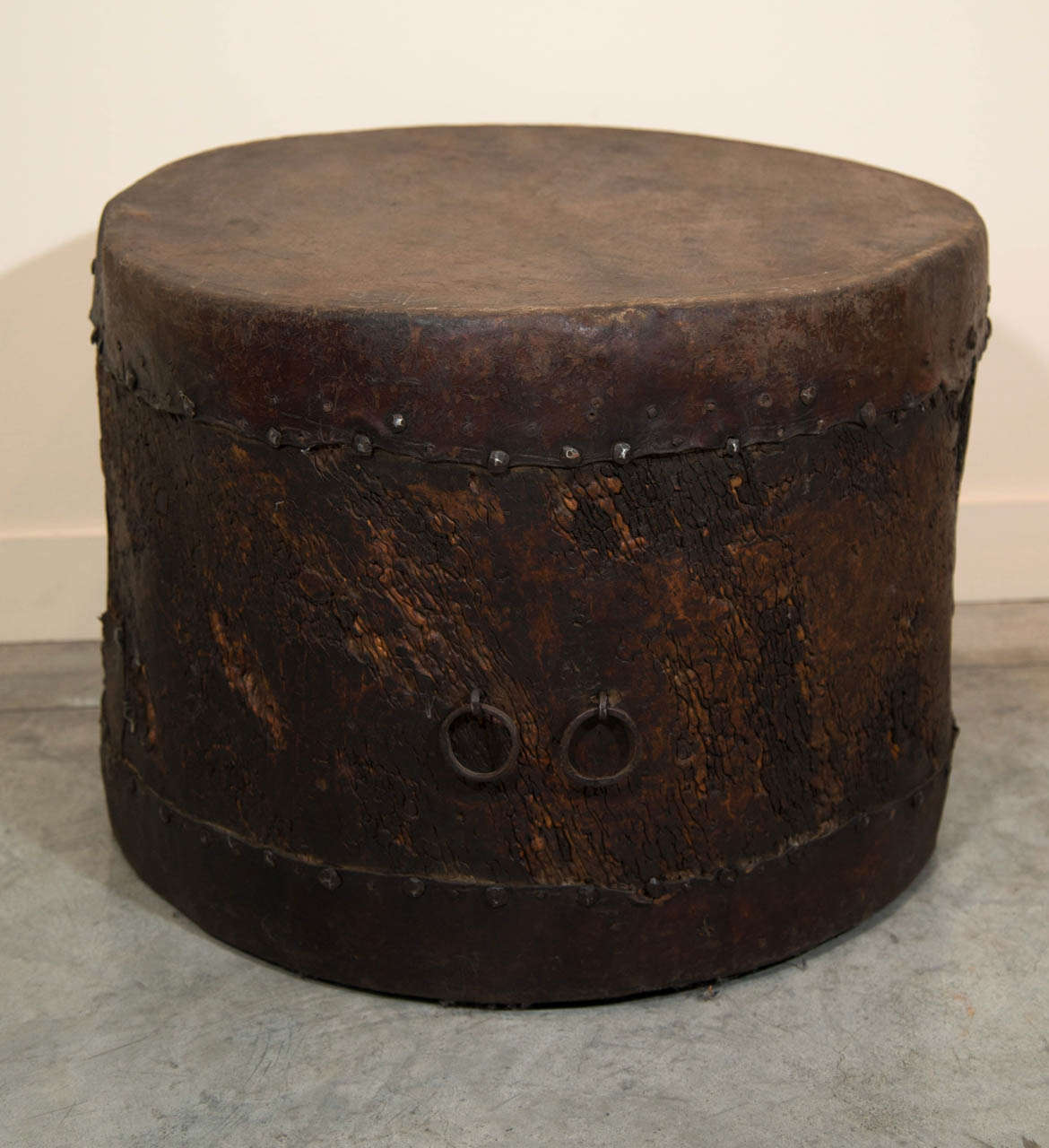 A fabulously worn antique poplar wood drum with original skin and slightly irregular shape. This piece would make a wonderful side or coffee table.
From Gansu Province, c.1880.
M907