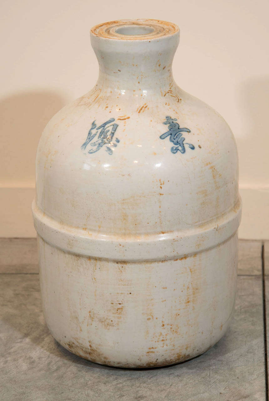A very heavy and thick walled Chinese porcelain wine jar with beautiful blue characters.  From Shandong Province, c. 1920.
CR720