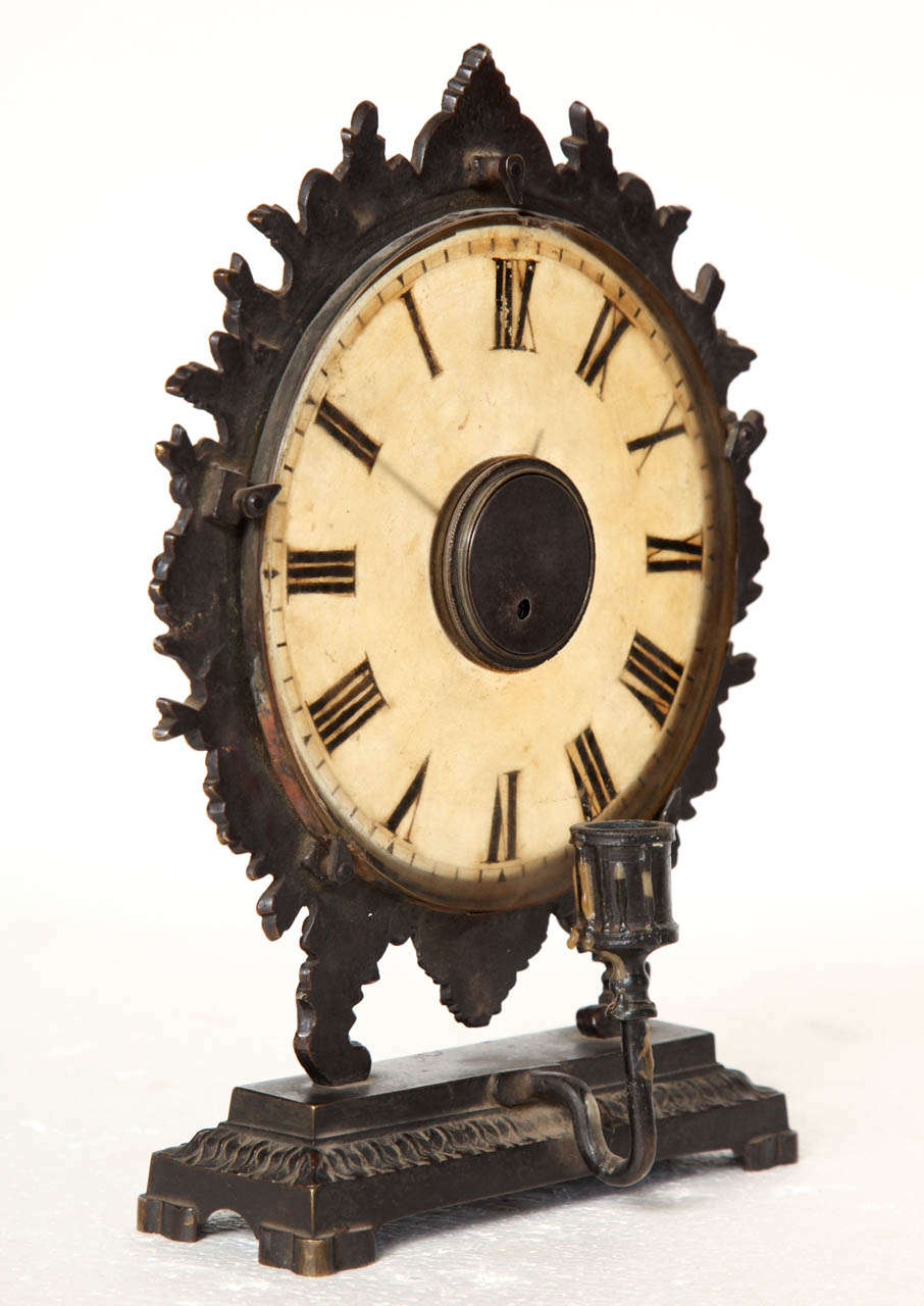 19th Century Continental Bronze Clock with a Frosted Glass Face and a Candleholder Behind the Face