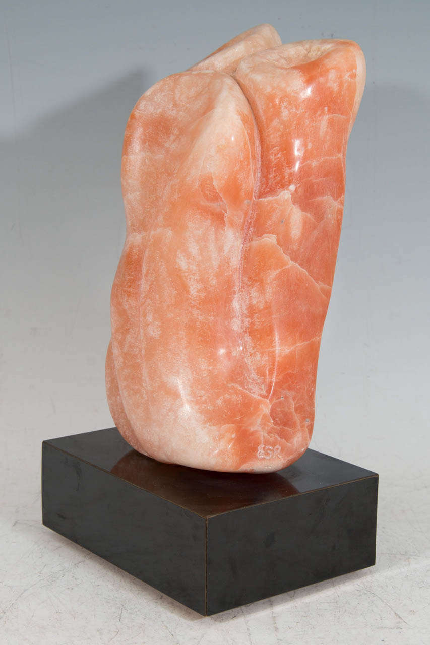 American A Coral Colored Stone Sculpture with Revolving Base, Signed ESR