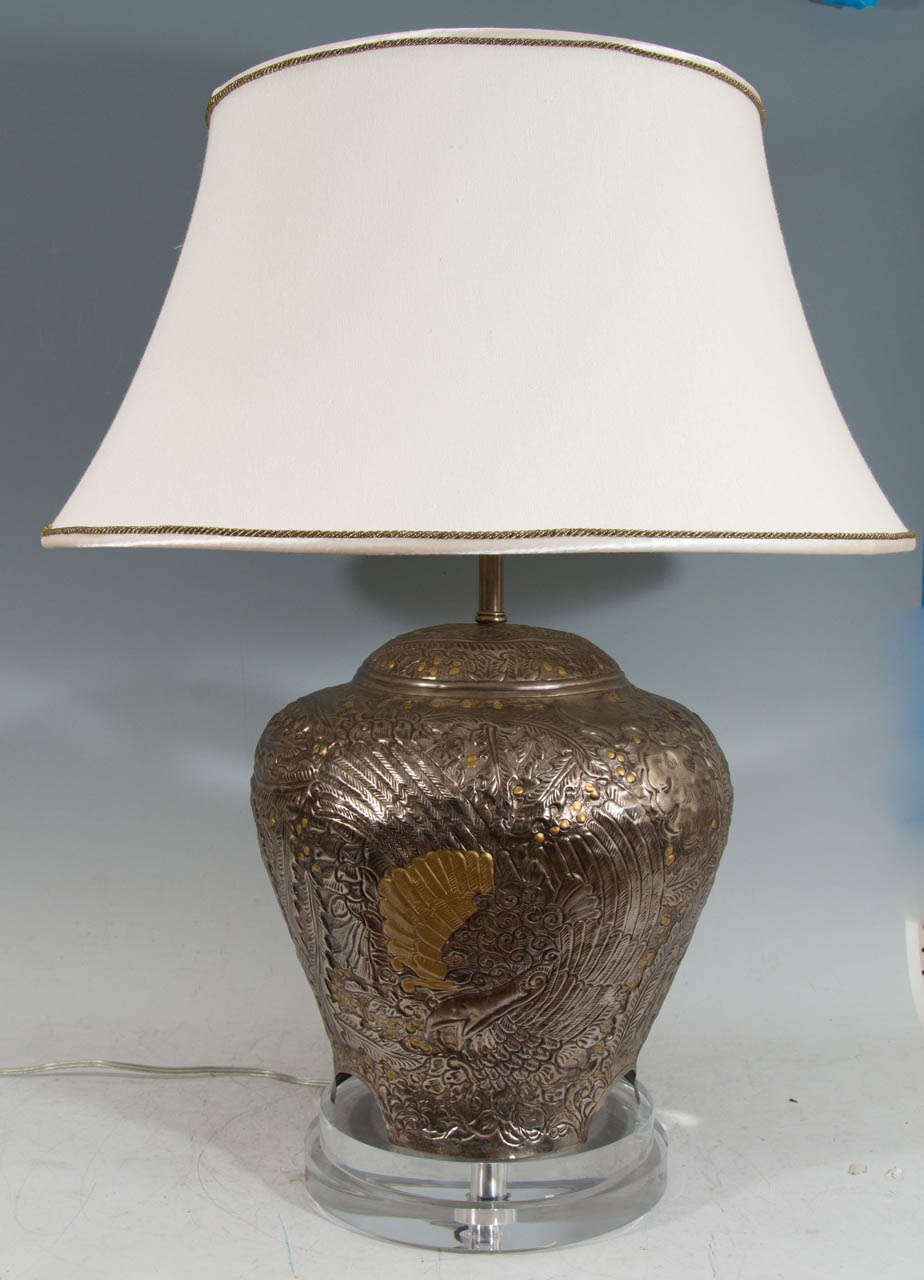 A pair of table lamps made of hammered pewter and brass mounted on Lucite bases with hand sewn shades.

Good condition with age appropriate wear.