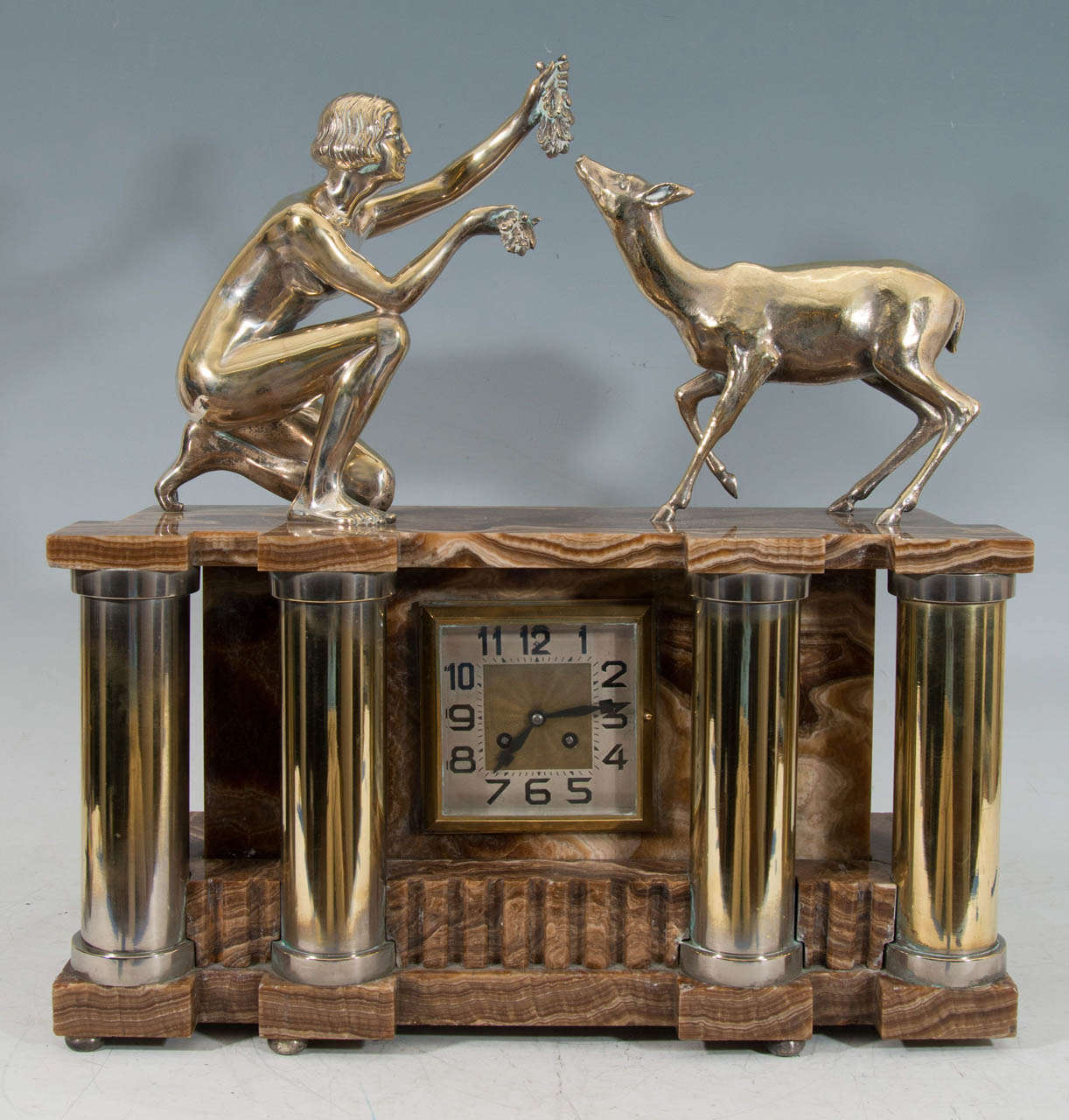Amazing Glorious Heavy French Art Deco silvered bronze and onyx clock decorated with four columns and a Nude Diana feeding a Deer.Slight wear to silvered bronze.An Great Clock for a Console Table with two  High End candlesticks beside it.

