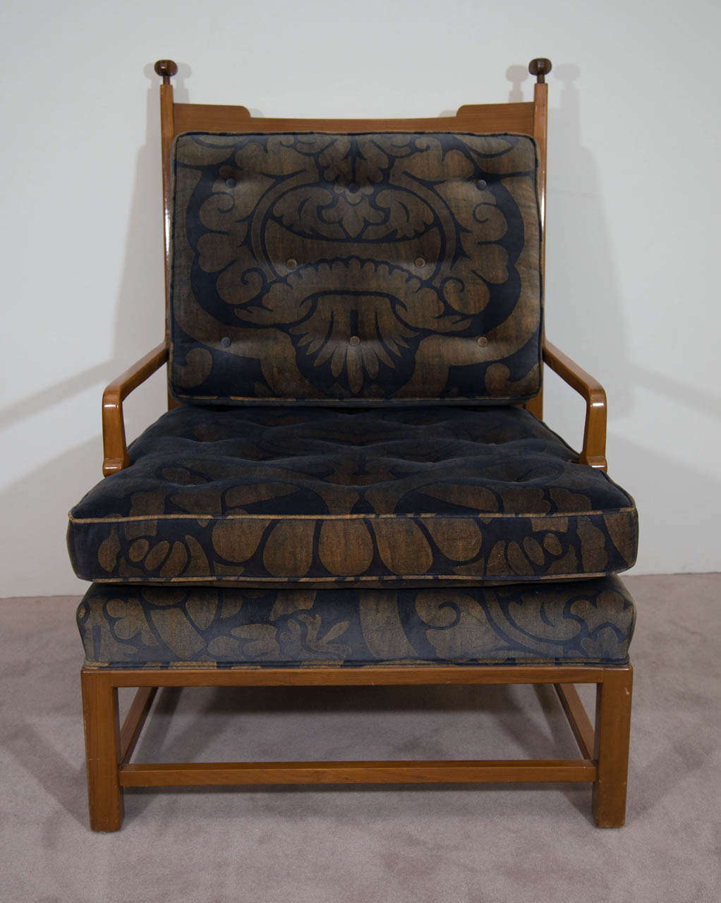 A vintage pair of walnut arm chairs designed by Tommi Parzinger upholstered in their original blue and gold velvet fabric.

Vintage condition with some nicks and wear to the wood and some fading and spotting to upholstery.