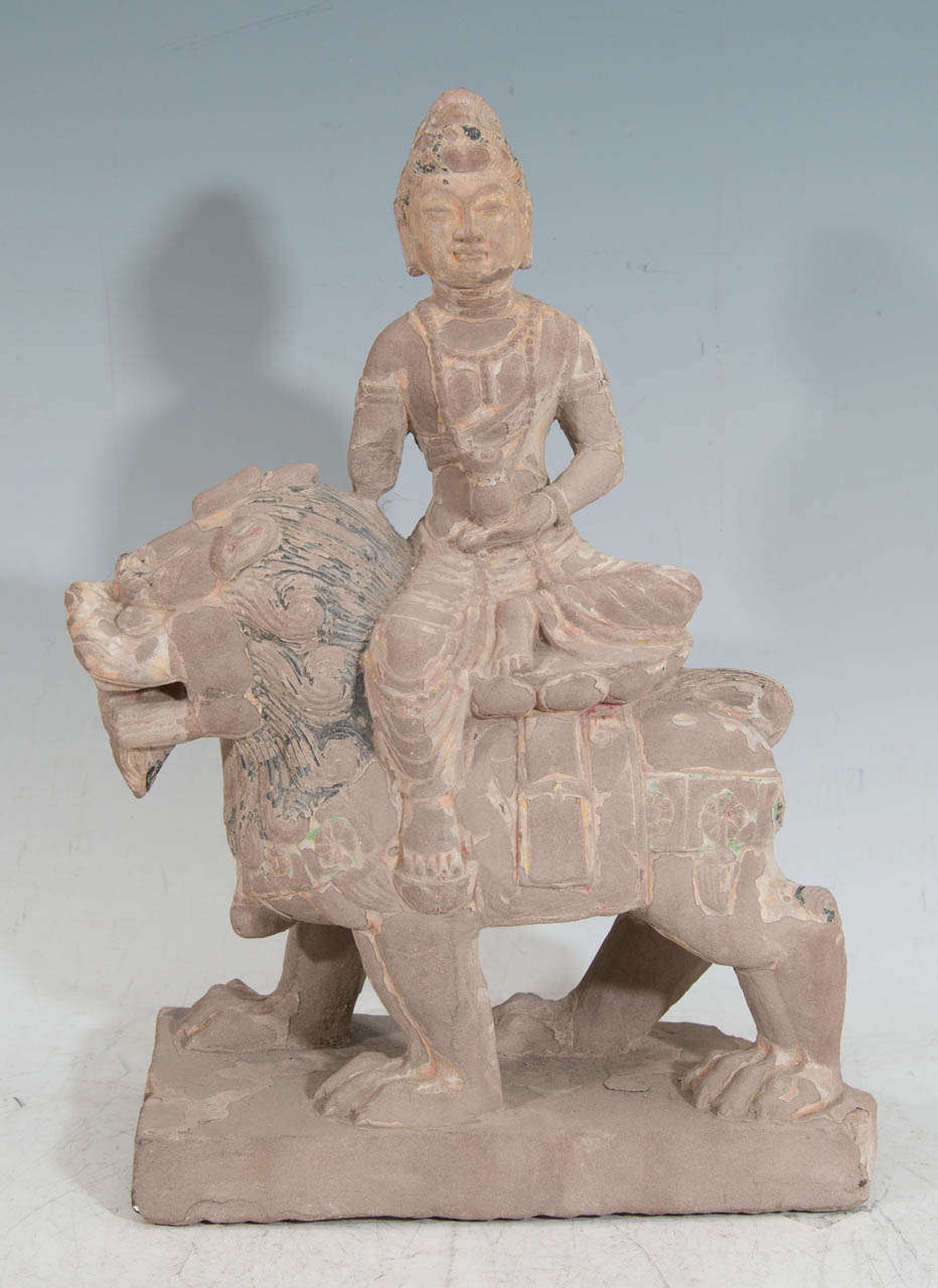 A 10th Century Tang Dynasty architectural fragment (found in an American collection before 1970) of a fine and rare Chinese hand carved, polychromed limestone Guanyin riding on a vigorous Buddhist lion.

Provenance: Peter Rosenberg, Vallin