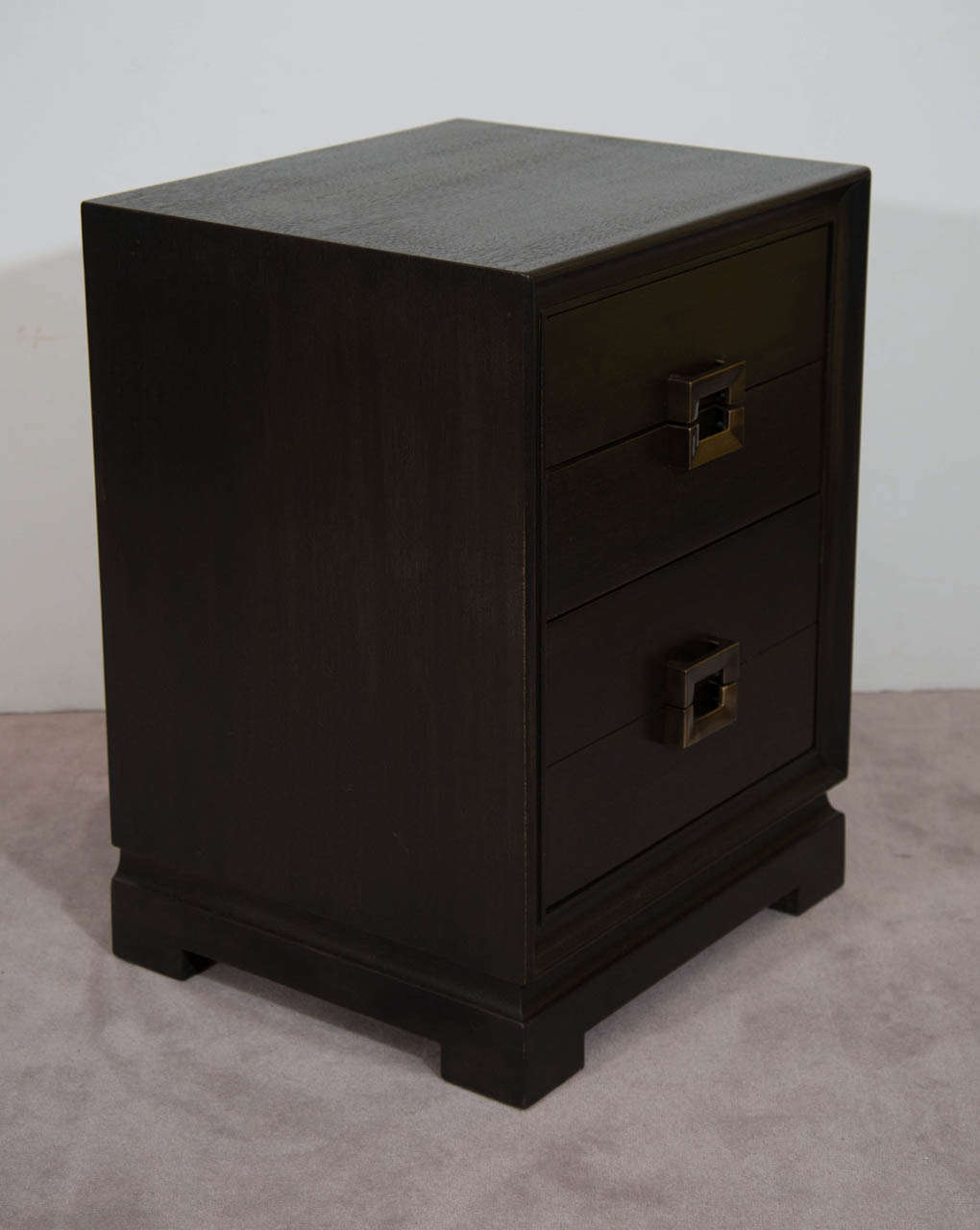A vintage pair of lacquered mahogany three-drawer night stands with brass pulls by Red Lion Furniture Company.  During the period these night stands were made Red Lion was in collaboration with designers like Charles Eames and Eero Saarinen as well