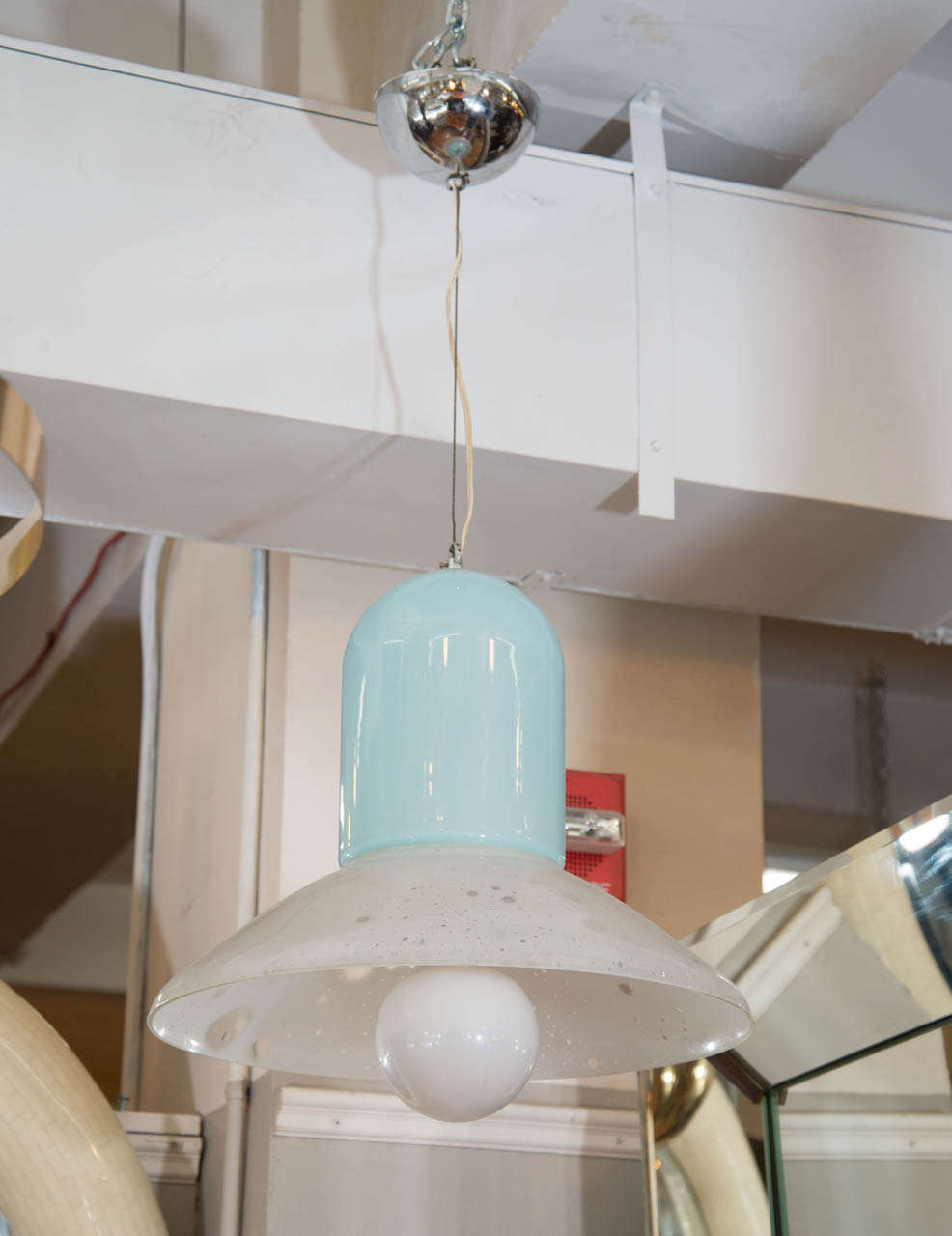 A vintage Italian Murano glass bell-shaped pendant in white and blue opaque glass. The white glass has clear spots for a 