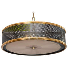 A Mid Century Perforated Light Fixture in the Style of Guariche
