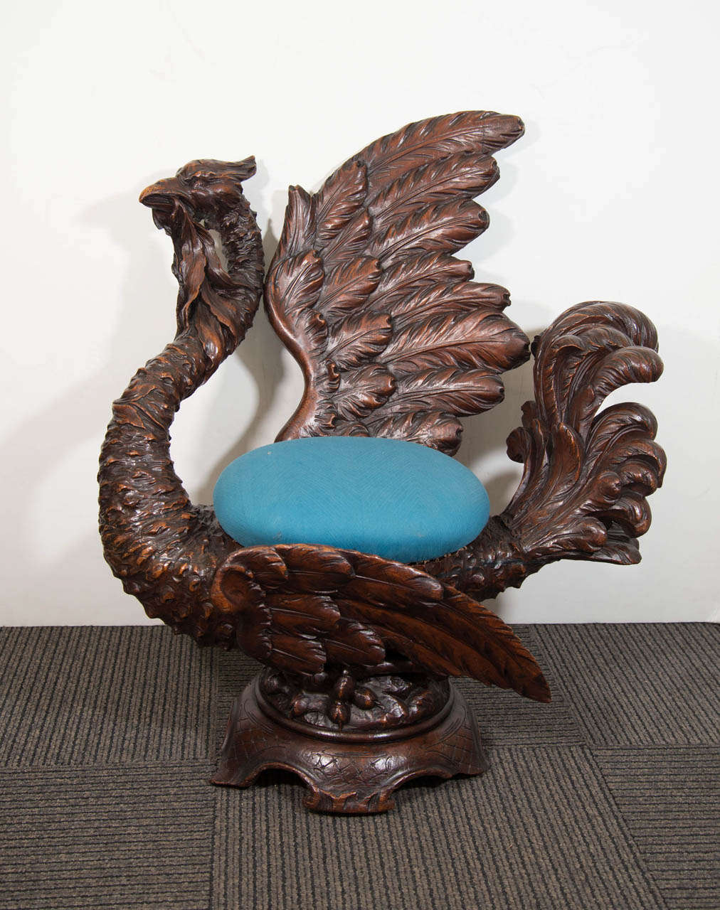 An antique 19th century hand carved Italian walnut fantasy chair of a griffin with seat upholstered in a blue silk fabric.

Good condition with age appropriate wear.  A few cracks to the wood.

Reduced from:  $4,500