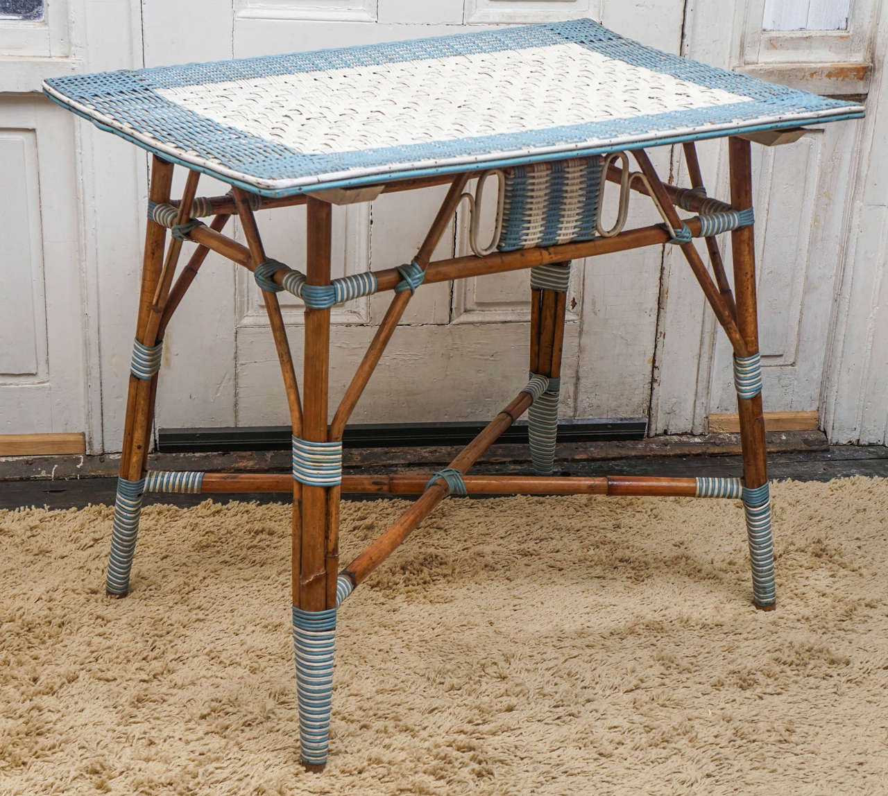 This table made circa 1950 is a great example of simple material used to its best advantage. While we do not know exactly who made this piece, it seems most likely American in manufacture & perhaps Haywood Wakefield. The piece is beautifully