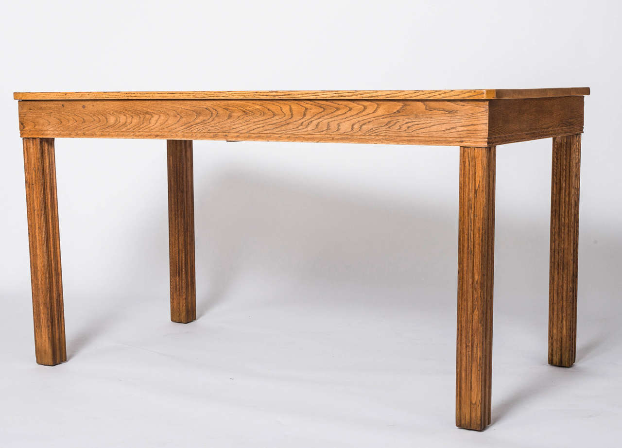 An early Gordon Russell Refectory Table.
Japanese Oak.
The frieze and the legs with ribbed fluting.
Paper label to base.
Design no. 853.
Foreman Edgar Turner. Cabinet Maker C.Gutteridge
Dated February 4th 1930.
English.
76 x 76 x 140 cm