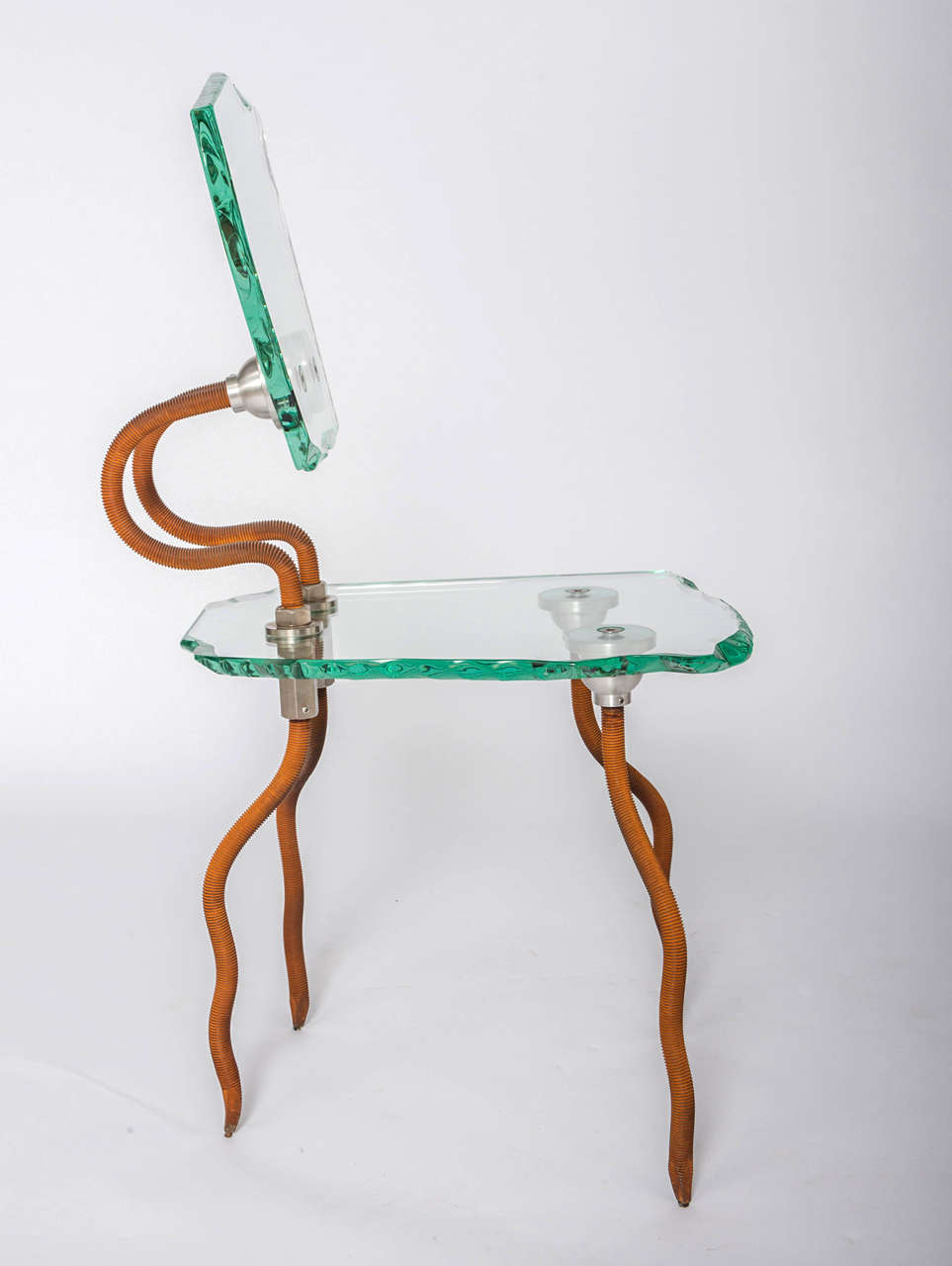 A Danny Lane “Etruscan Chair”.
For Danny Lane Studios.
Designed 1984 and executed in 1988.
Sand blasted and rusted steel, forged Stainless-steel and hammer chipped polished glass.
Etched signature Danny Lane 8/100 88 RF
90 x 38 48 cm