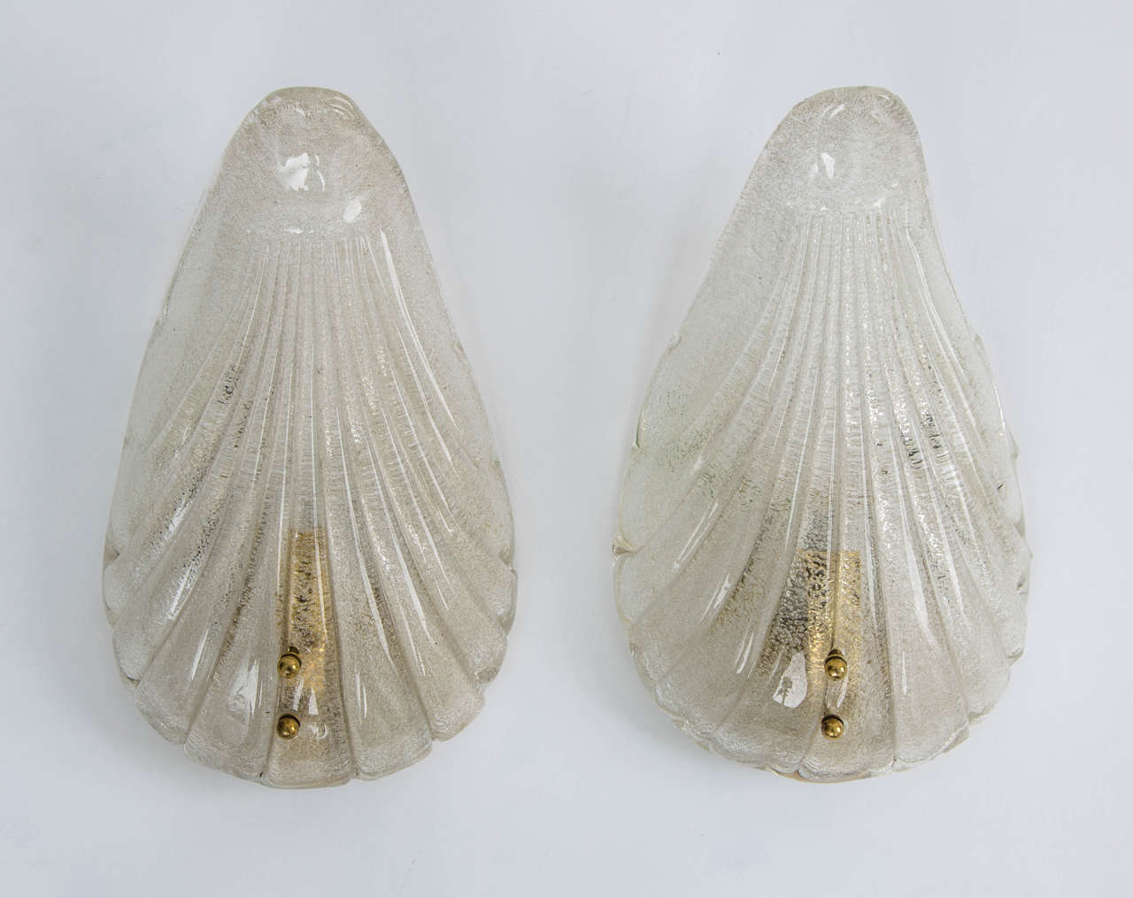 Pair of wall lights by Mazzega, prod., Italy, Murano, circa 1940.
Dimensions: Height 27.00 cm - 10.62 in.
Max width 17.00 cm - 6.69 in.
Min width 6.00 cm - 2.36 in.
Depth 9.50 cm - 3.73 in.
Free shipping to London.