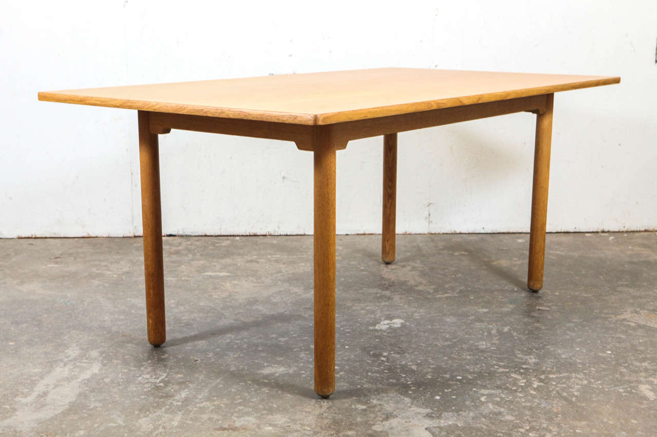 Rectangular table with deep overleaf in simple post legs. For dining or workspace.