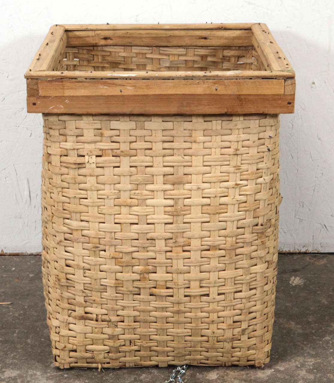 Rustic square wood and wicker basket.
