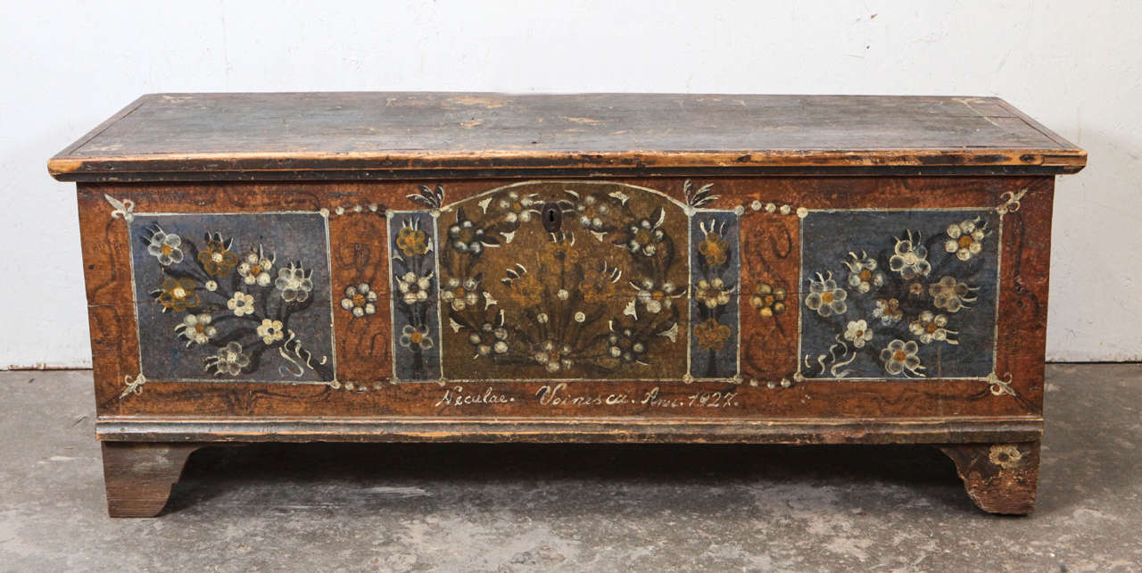 Rustic blanket chest with hand painted flower triptych.